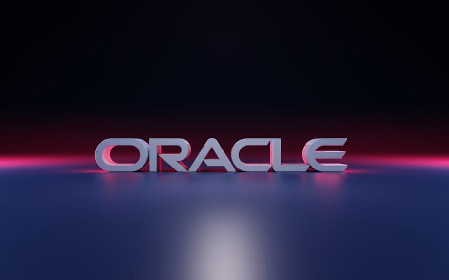The word ORACLE in bold, 3D letters is displayed on a reflective surface with a dark gradient background.