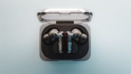 A pair of ear buds sitting in a case