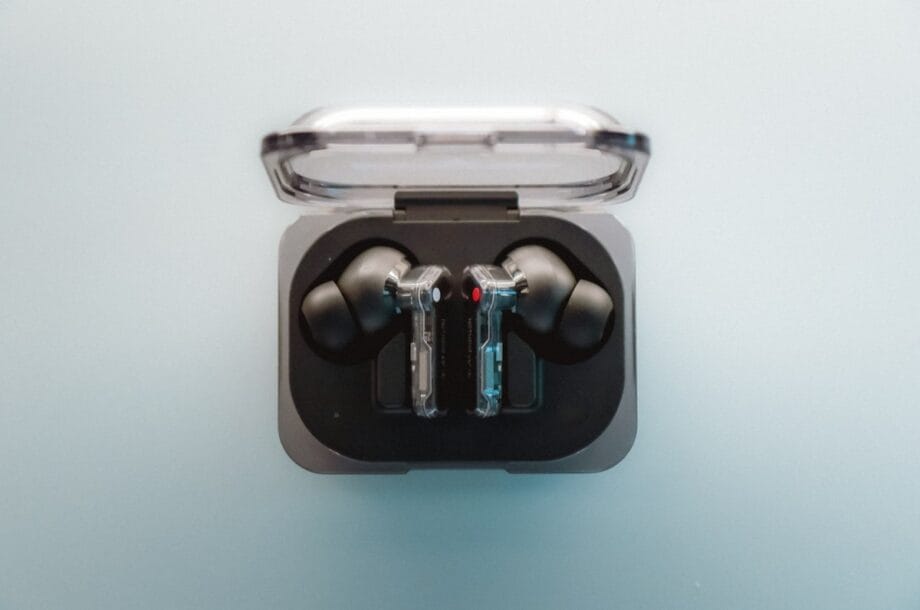 A pair of ear buds sitting in a case