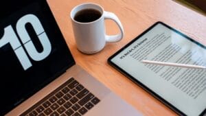 a tablet and a cup of coffee on a table