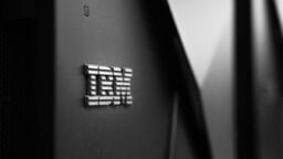 Close-up of the metallic IBM logo on the side of a black server or computer hardware unit.