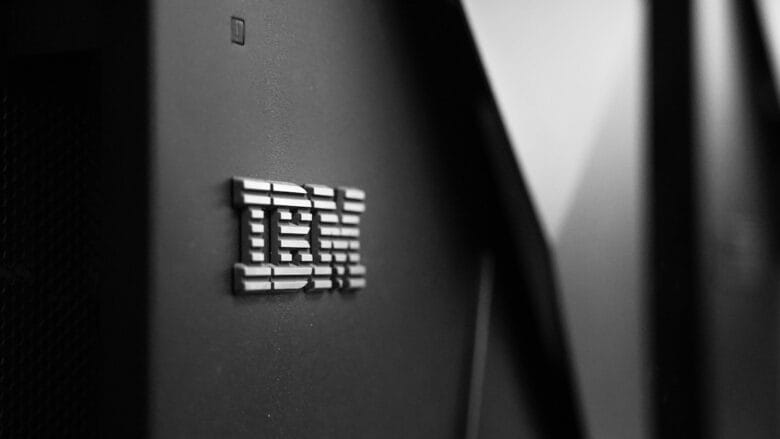 Close-up of the metallic IBM logo on the side of a black server or computer hardware unit.