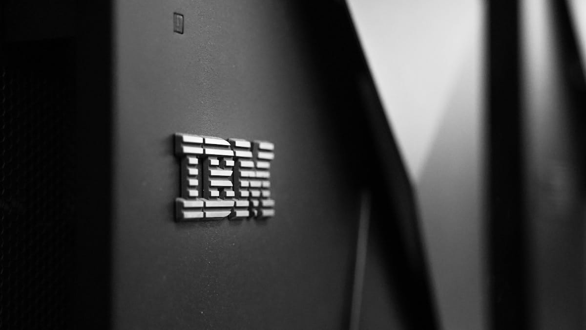 Close-up of the metallic IBM logo on the side of a black server or computer hardware unit.