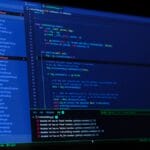 A computer screen displays Python code and a list of files in a code editor with an error message at the bottom panel.