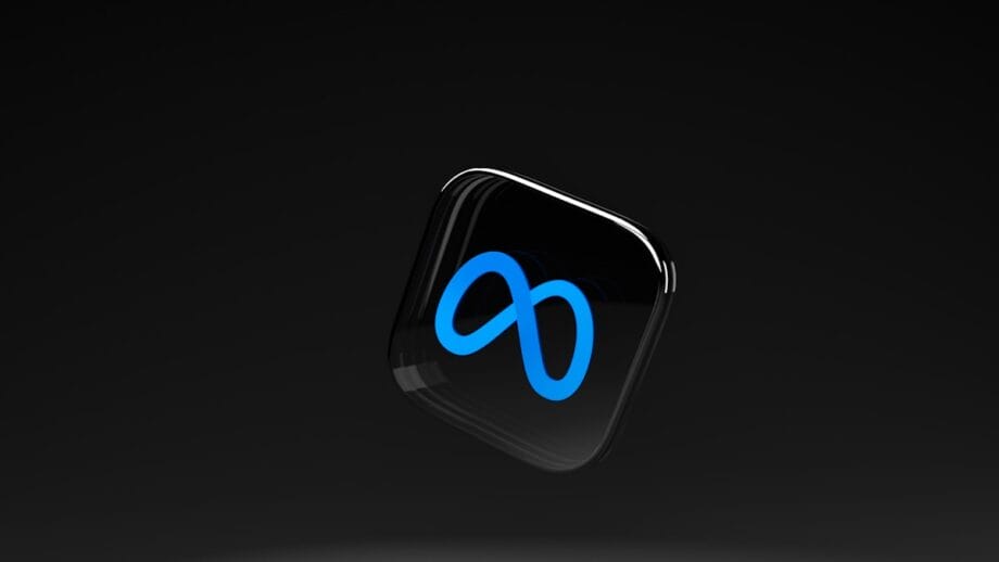 A black rounded square with a blue Meta logo floats against a dark gradient background.