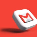 A 3D Gmail logo icon floats against a solid red background, casting a shadow below it.