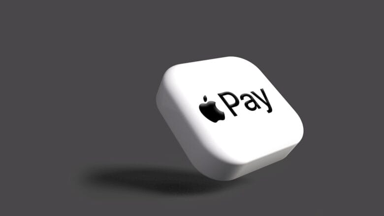 A white square with the Apple Pay logo on it, floating against a plain gray background.