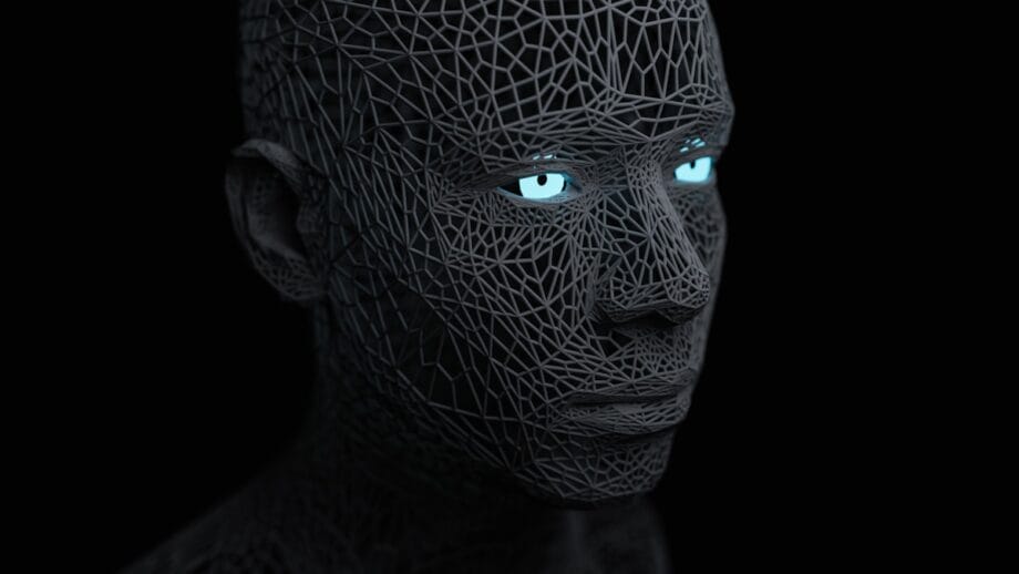 A 3D-rendered human head made of dark geometric mesh with glowing blue eyes set against a black background.