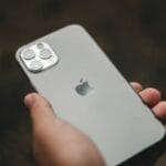 a person holding an iphone in their hand