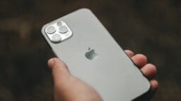 a person holding an iphone in their hand