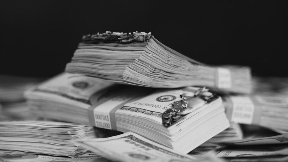 a pile of money sitting on top of a table