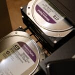 two hard drives are stacked on top of each other