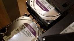 two hard drives are stacked on top of each other