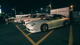 a group of cars parked next to each other in a parking lot
