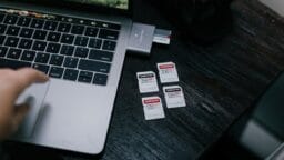 white and black labeled box on macbook pro