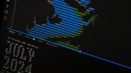 A close up of a computer screen with a monkey on it