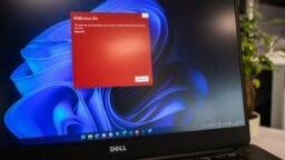 a dell laptop computer with a red screen