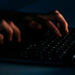 Person using black laptop computer photo