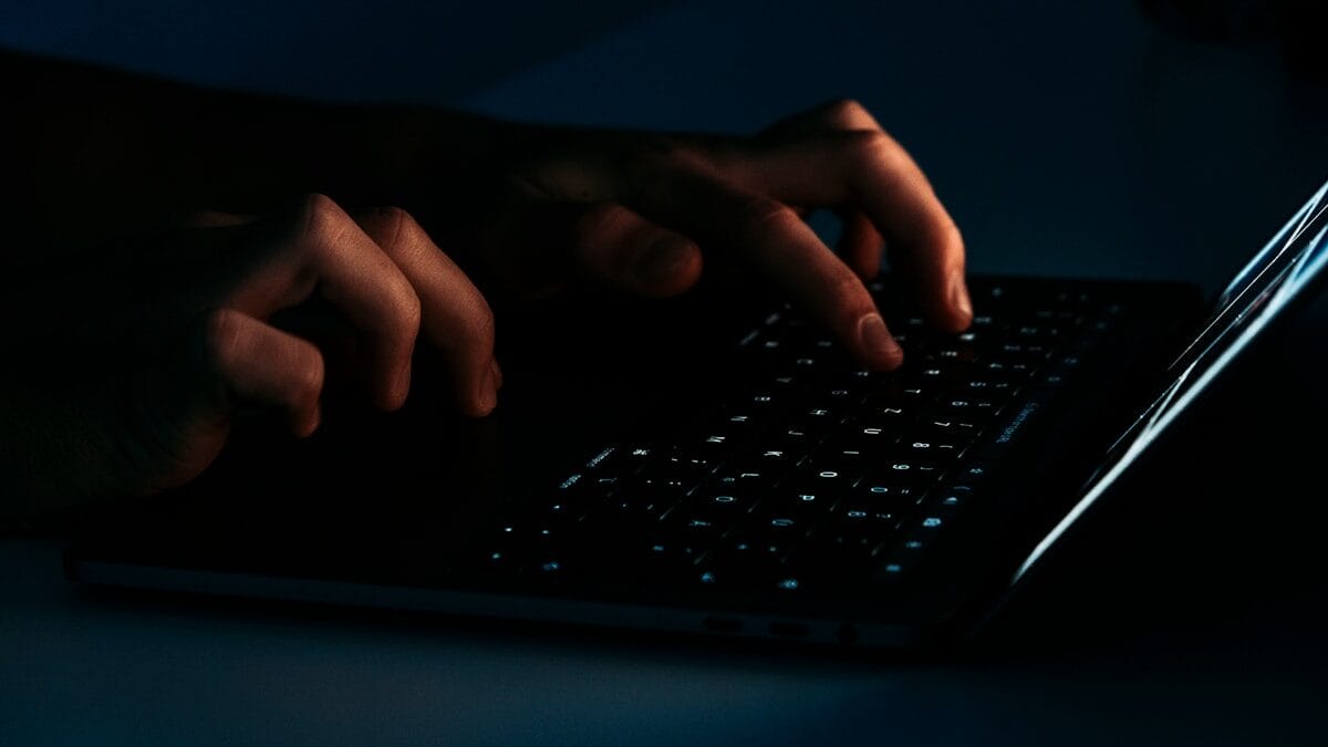 Person using black laptop computer photo