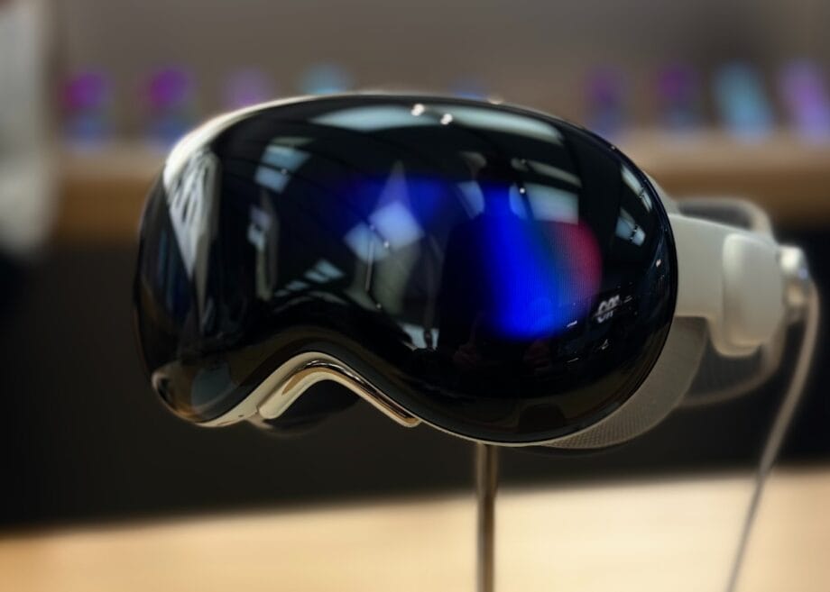 A pair of ski goggles sitting on top of a wooden table