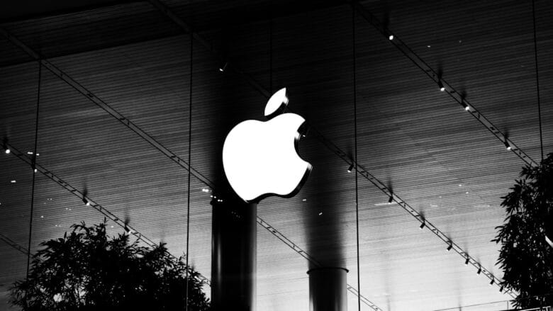 A black and white photo of an apple logo