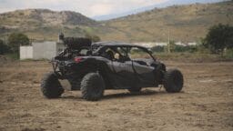 black UTV on field during daytime