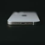 silver iphone 6 on black surface