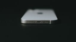 silver iphone 6 on black surface