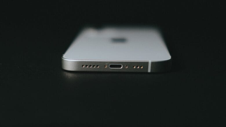 silver iphone 6 on black surface