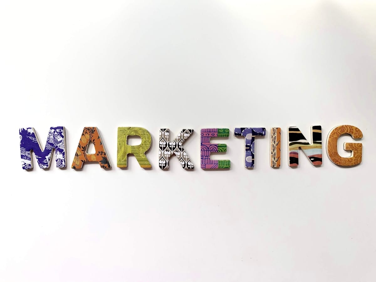 The word “MARKETING” spelled out in colorful, patterned block letters on a plain white background.
