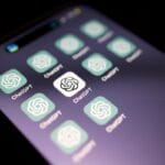 A smartphone screen displays multiple ChatGPT app icons with a dark background.