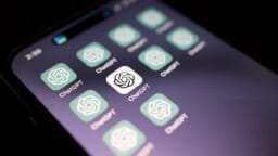 A smartphone screen displays multiple ChatGPT app icons with a dark background.