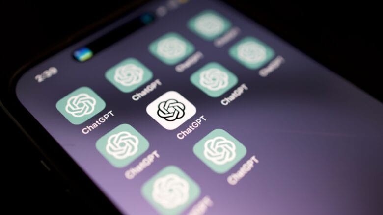 A smartphone screen displays multiple ChatGPT app icons with a dark background.
