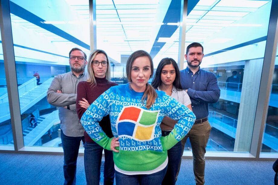 woman wearing blue Windows sweater standing