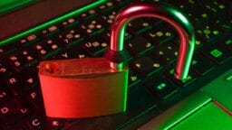 red padlock on black computer keyboard