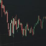 Stock market chart shows a declining trend.