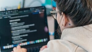 A woman looking at a computer screen.