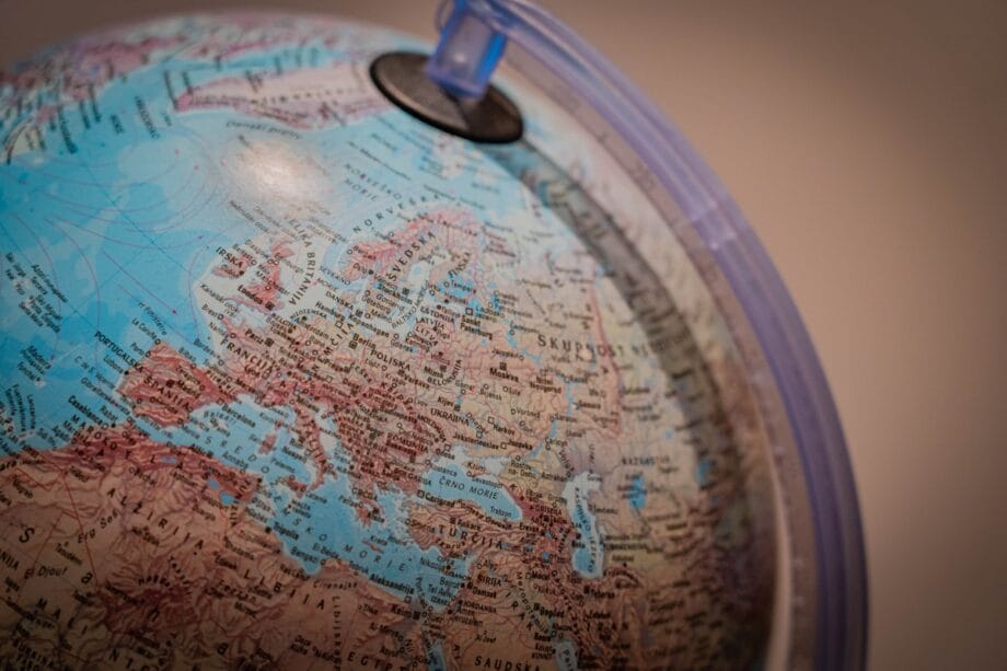 A close-up of a globe showing Europe, including countries like Germany, Poland, Italy, and surrounding regions.
