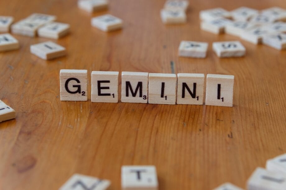 A wooden table topped with scrabble tiles that spell out the word germin