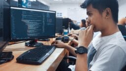 person holding a computer mouse in a room