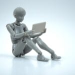 A gray humanoid mannequin sits on the ground holding a tablet against a plain white background.