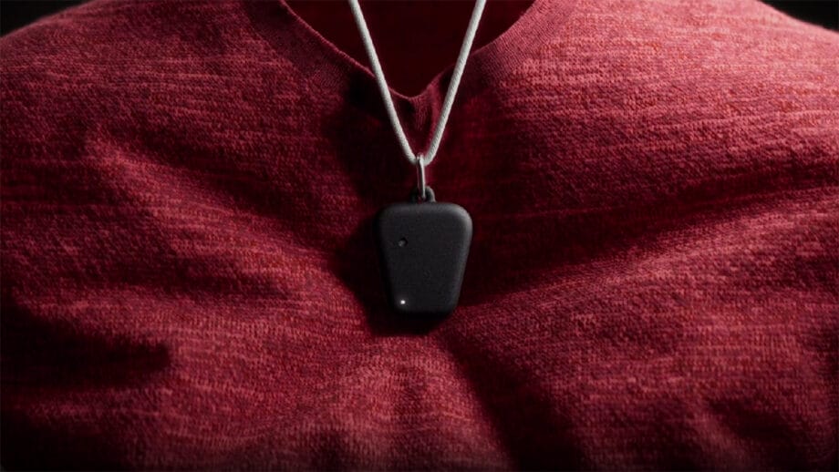 A person wearing a red shirt has Fieldy device hanging from a silver cord around their neck.