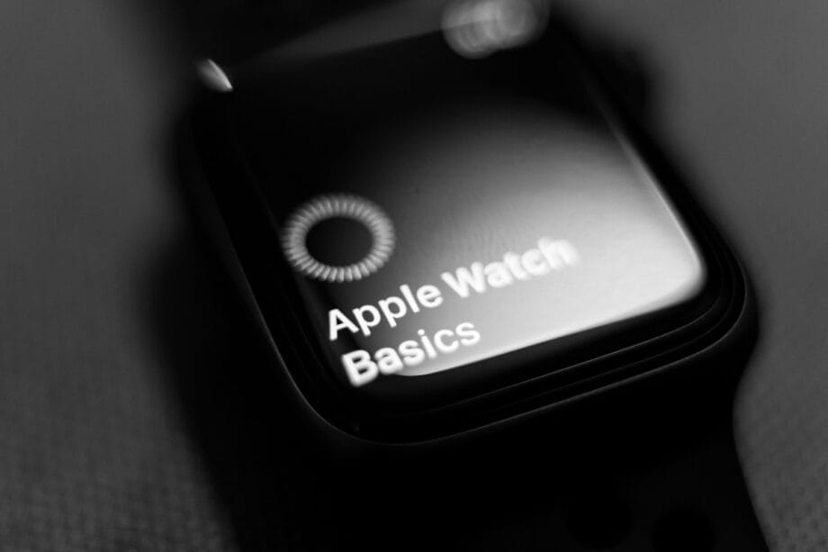 Close-up of an Apple Watch displaying the text Apple Watch Basics on its screen.