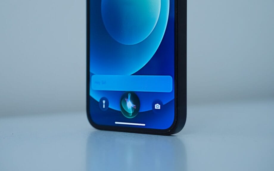 Close-up of a smartphone screen displaying the Siri voice assistant interface.