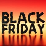 Black Friday text in bold black 3D letters on a red and orange gradient background with reflections below.