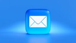 A blue 3D square icon featuring a white envelope symbol on a blue gradient background.