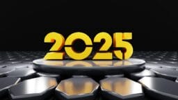 Large golden 2025 on a raised circular platform, surrounded by hexagonal metal tiles under dramatic lighting.