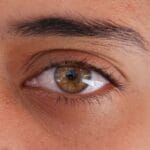 a close up of a person's brown eye
