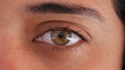 a close up of a person's brown eye