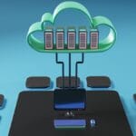 A 3D illustration of cloud computing, showing servers in a cloud connected to a desktop computer with peripheral devices.